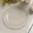 Clear decorative plate with a scalloped edge and glitter accents.