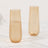 Two elegant amber tumblers on a white surface.