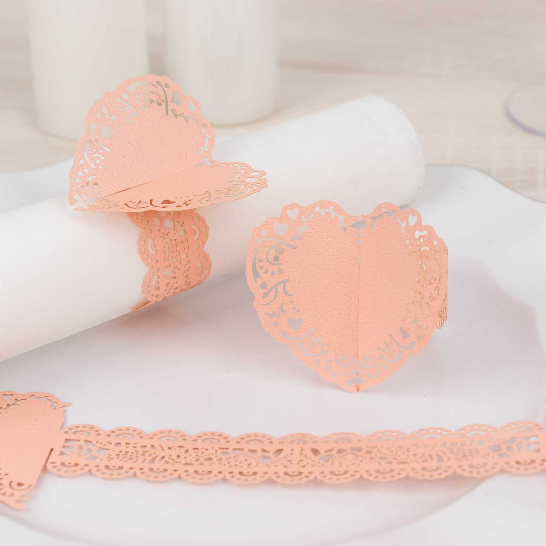 Peach lace heart napkin rings and decorative border for table settings