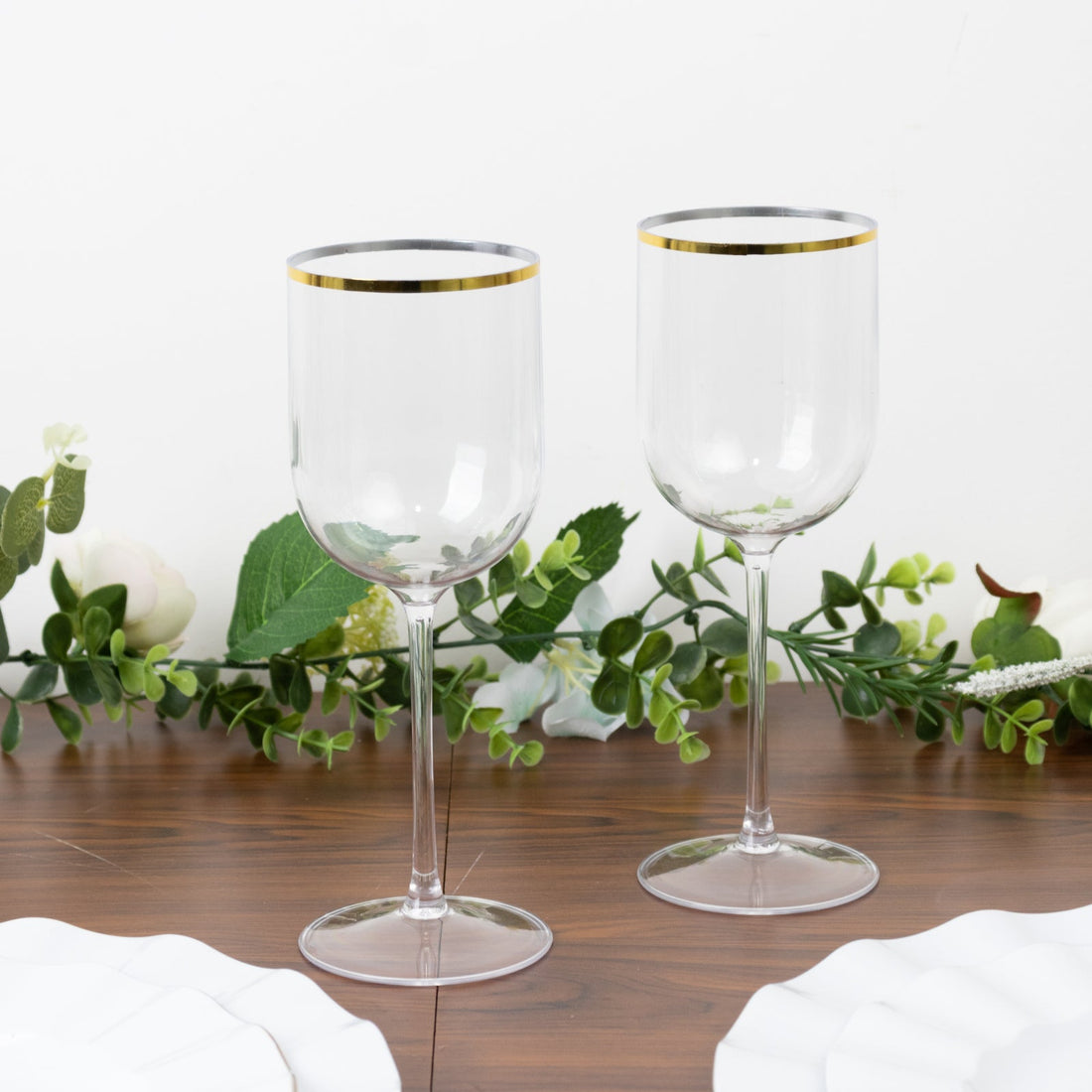 Elegant clear wine glasses with gold rim, perfect for any occasion.