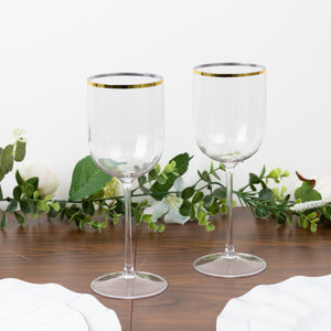 Elegant clear wine glasses with gold rim, perfect for any occasion.