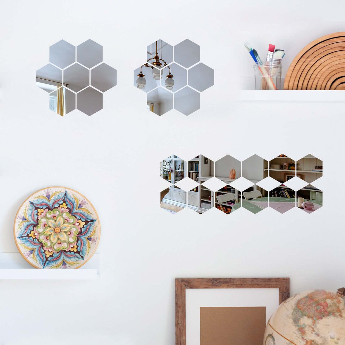 Decorative hexagonal mirrors displayed on shelves in a modern interior setting.