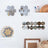 Decorative hexagonal mirrors displayed on shelves in a modern interior setting.