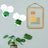 Decorative wall mirrors in hexagonal shapes reflecting green leaves