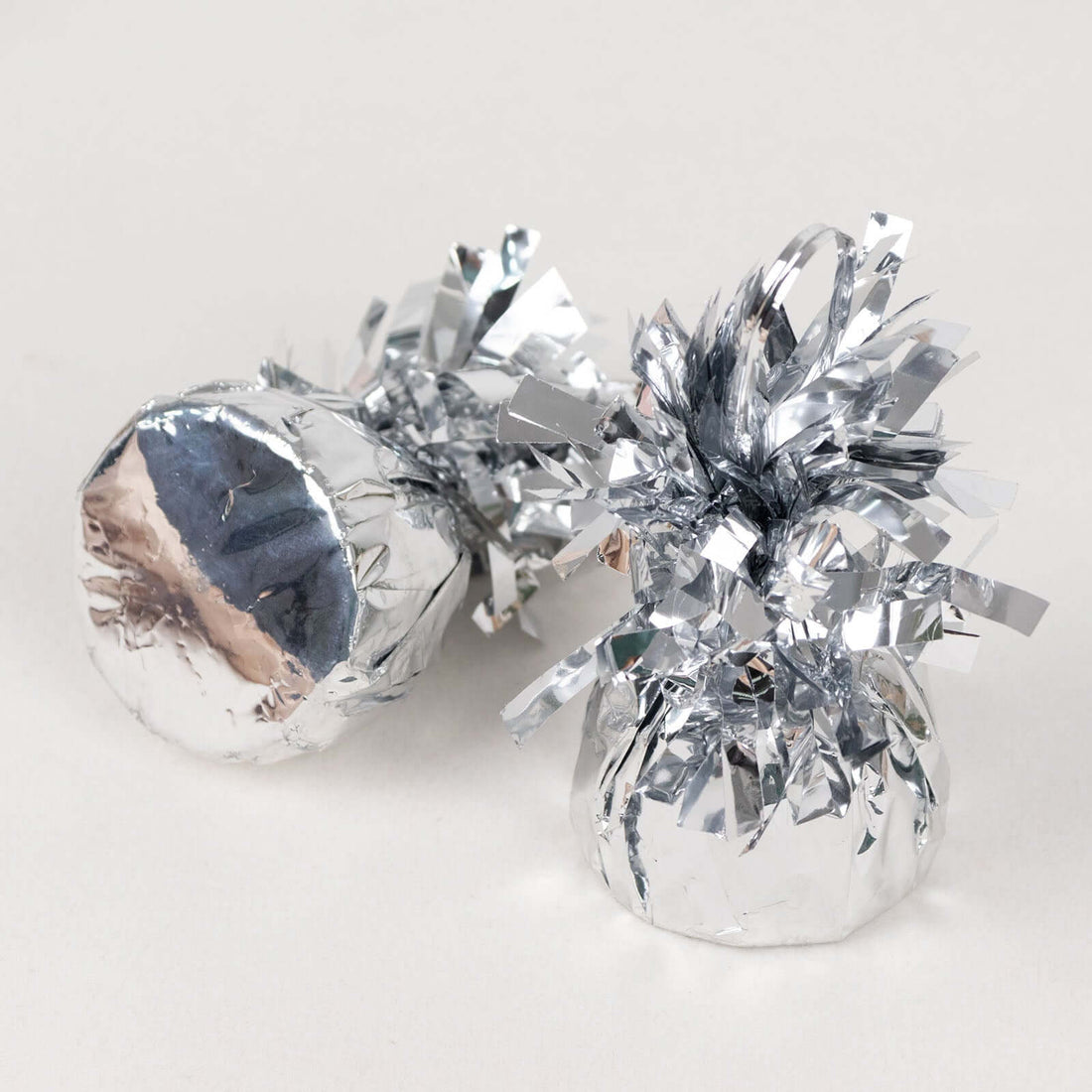 Silver gift wraps with decorative fringes
