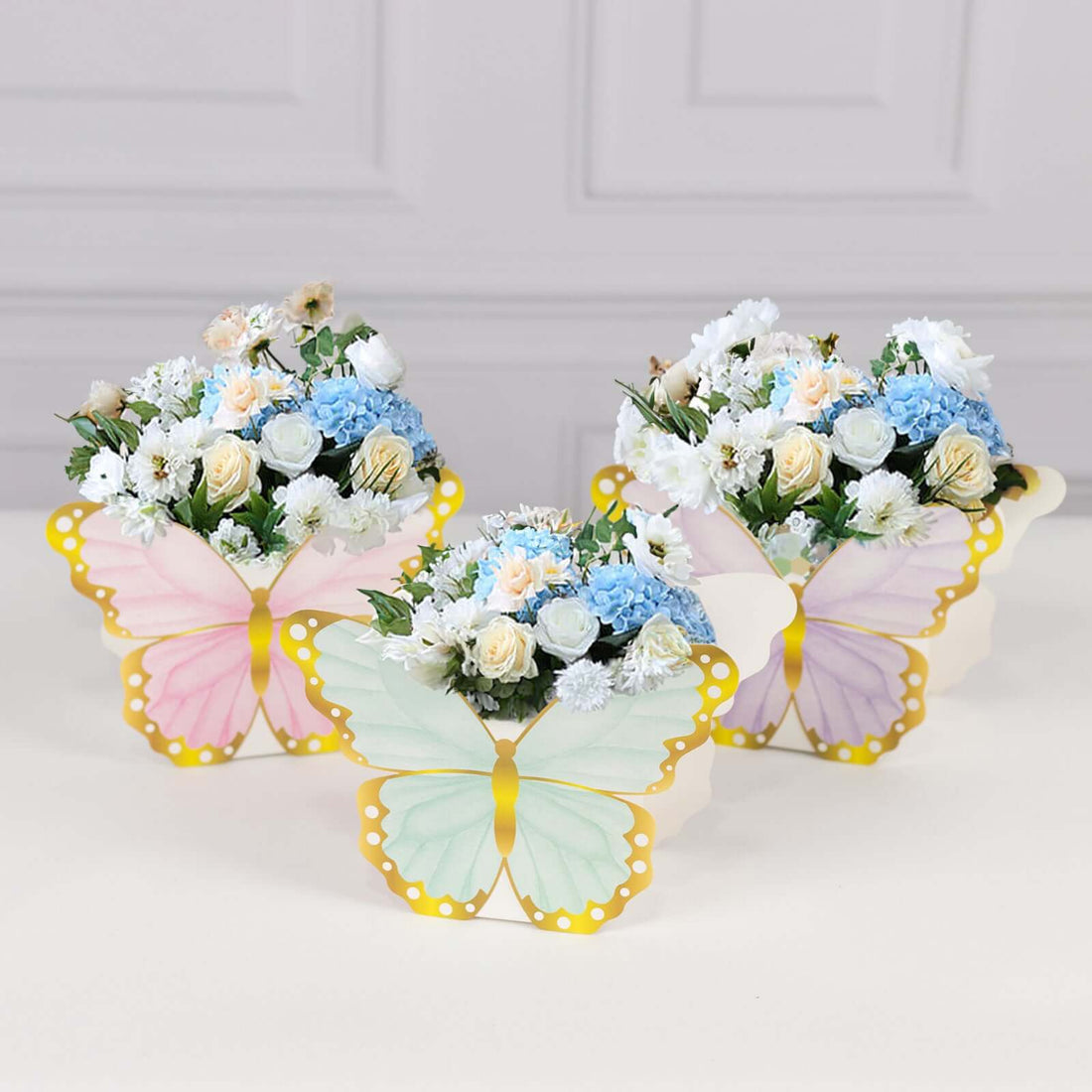 Colorful butterfly-shaped flower arrangements in pastel colors.