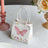 Floral butterfly gift bag on a table setting