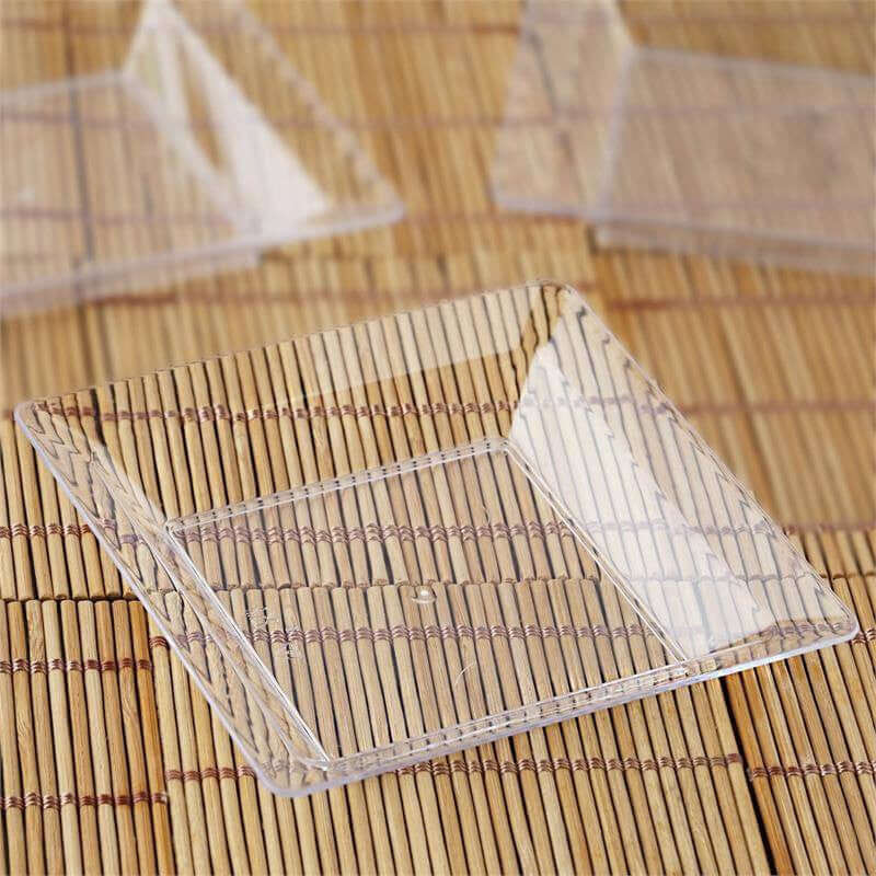 Clear square acrylic plate on a bamboo mat.