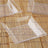 Clear square acrylic plate on a bamboo mat.
