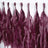 Purple tassel garland decoration hanging on a string.