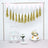 Decorative cake display with tiers, flowers, and bunting for a celebration.
