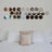 Decorative wall art featuring circular mirror cutouts above a bed.