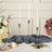 Elegant candle holders with white candles and floral arrangements on a table.