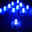 Blue LED tea light candles glowing in a dark setting. #whtbkgd