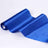 Royal blue satin fabric roll on a plain backdrop