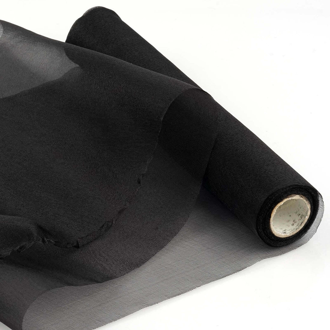 Black sheer fabric roll on a white background