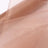 Sheer beige fabric draped elegantly, showcasing its soft texture. #whtbkgd
