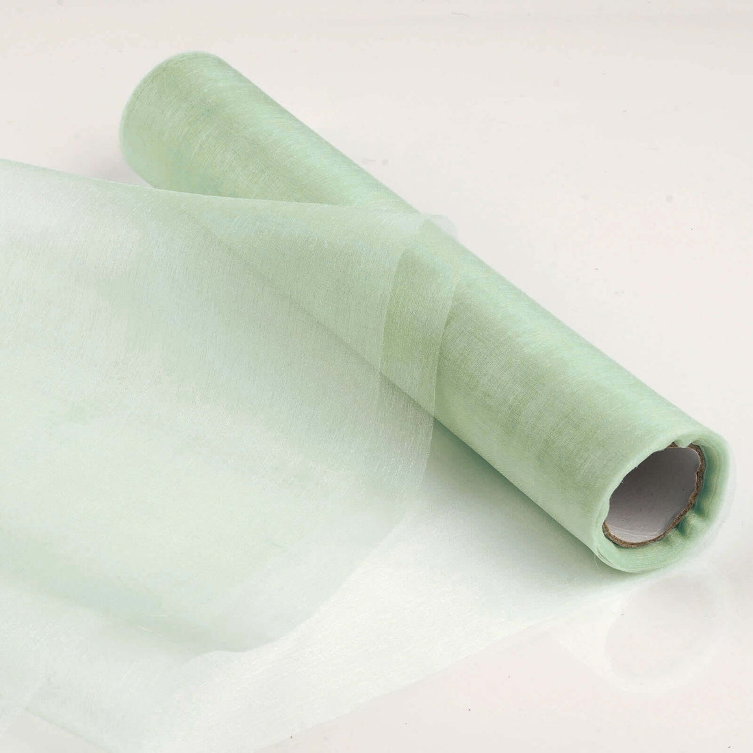 Roll of green tissue paper on a white background