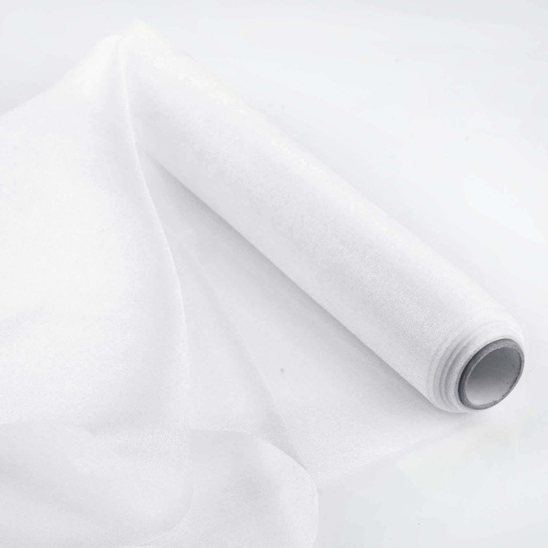 Roll of sheer white fabric on a white background.
