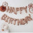 Rose gold "Happy Birthday" balloon decorations for festive celebrations.