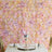 Elegant floral backdrop with pink and cream roses for event decor.