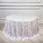Round floral tablecloth in light purple and white, draped elegantly on a table.