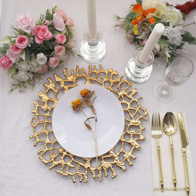 Elegant table setting with floral arrangement and gold plate charger.