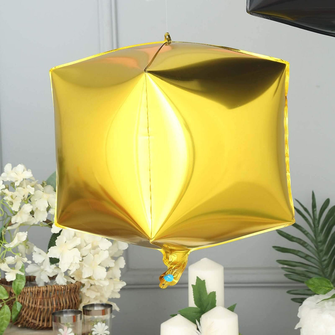 Gold geometric balloon decoration for parties and celebrations.