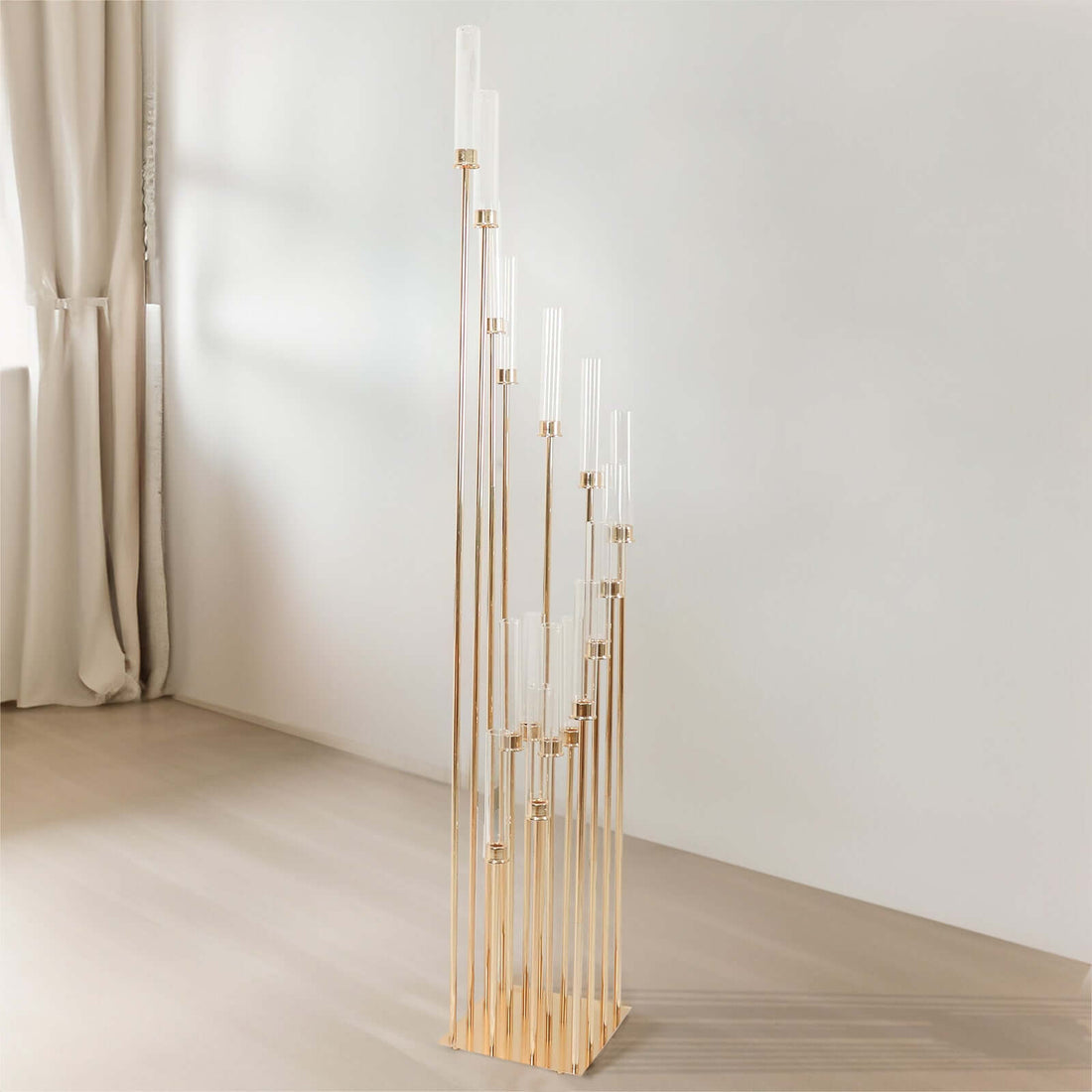 Elegant gold and clear glass flower vase with multiple tiers.
