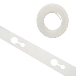 Clear double-sided tape roll and strip on a white background