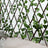 Artificial ivy garland on a wooden trellis backdrop.