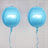 Two shiny blue balloons with ribbons