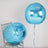 Two large blue foil balloons on a chair.