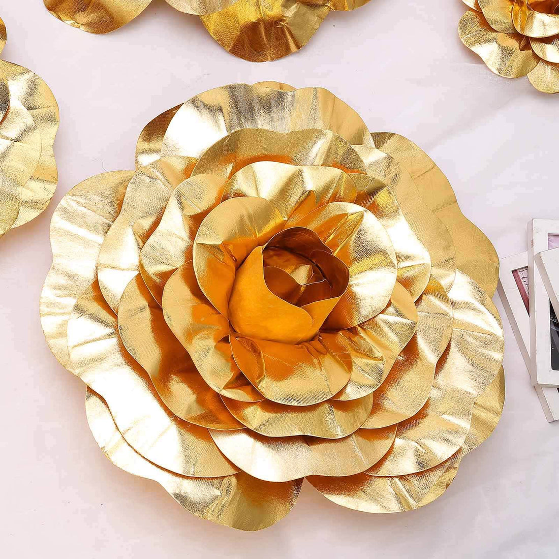 Gold metallic flower wall decor, perfect for home or event decoration. #whtbkgd