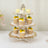 Three-tier cupcake stand with lemon cupcakes and macarons.