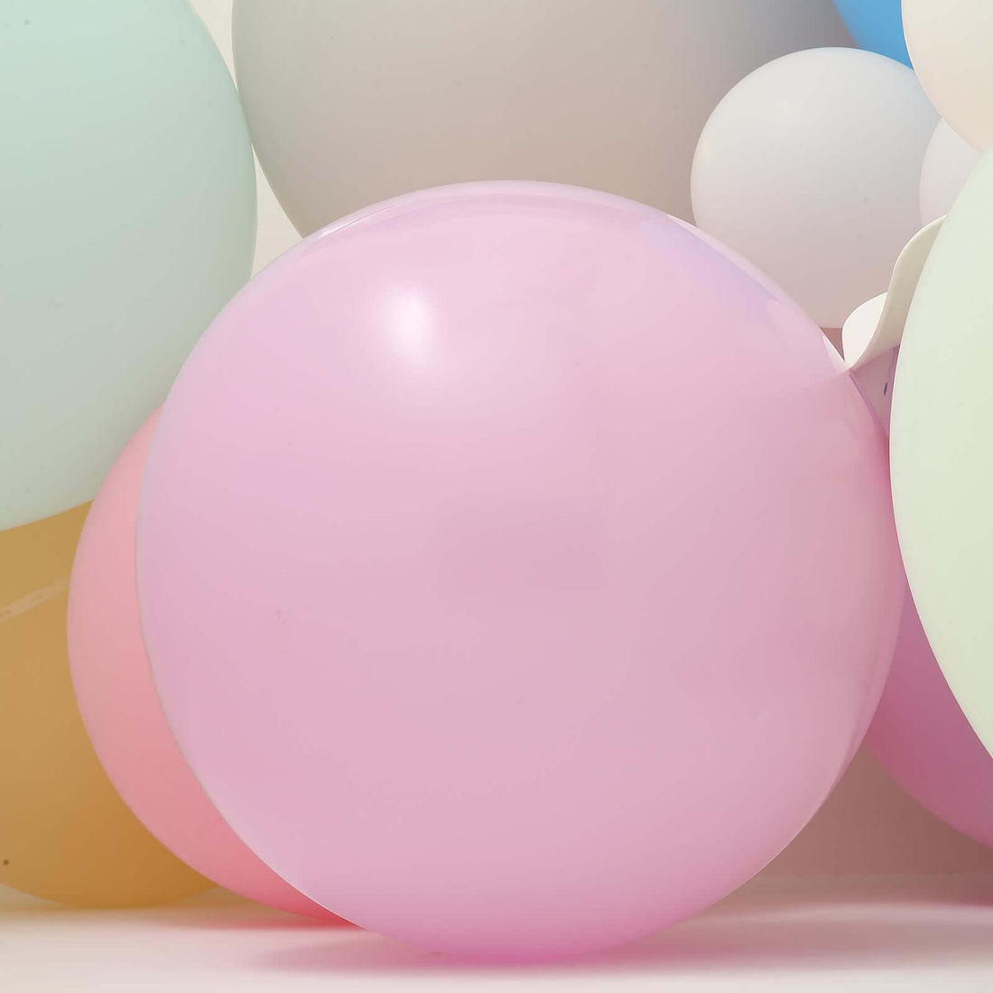 Colorful balloons in various pastel shades, perfect for celebrations.