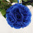 Blue artificial flower bouquet on a white backdrop.