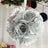 Silver floral ball decoration with ribbon hanger