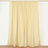 Cream-colored curtain panel hanging on a rod.