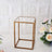 Clear acrylic display case with gold metal frame on textured white background.