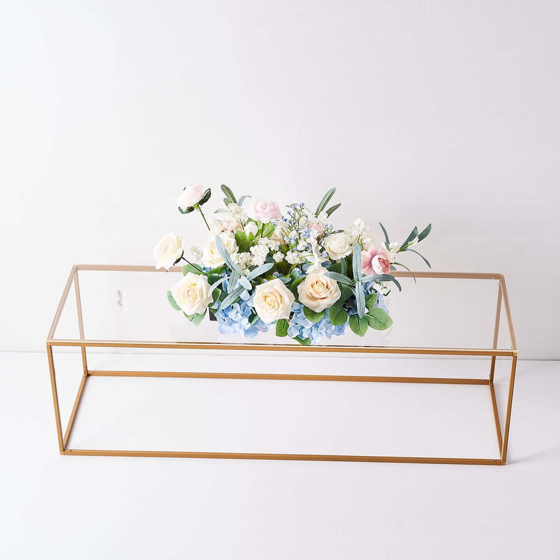 Gold geometric vase with artificial flowers