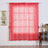 Pink sequin curtain hanging in a styled room with decorative elements.