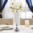 Elegant floral arrangement in a crystal vase for wedding decor.