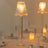 Elegant table lamp with a pleated shade, illuminating a stylish dining setup.