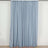 Light blue curtain draped on a rod, showcasing soft fabric texture.