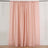 Soft pink curtain draping elegantly against a plain background.