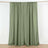 Olive green curtain panels hanging on a rod