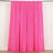 Pink curtain set on a rod, showcasing vibrant color and smooth texture.