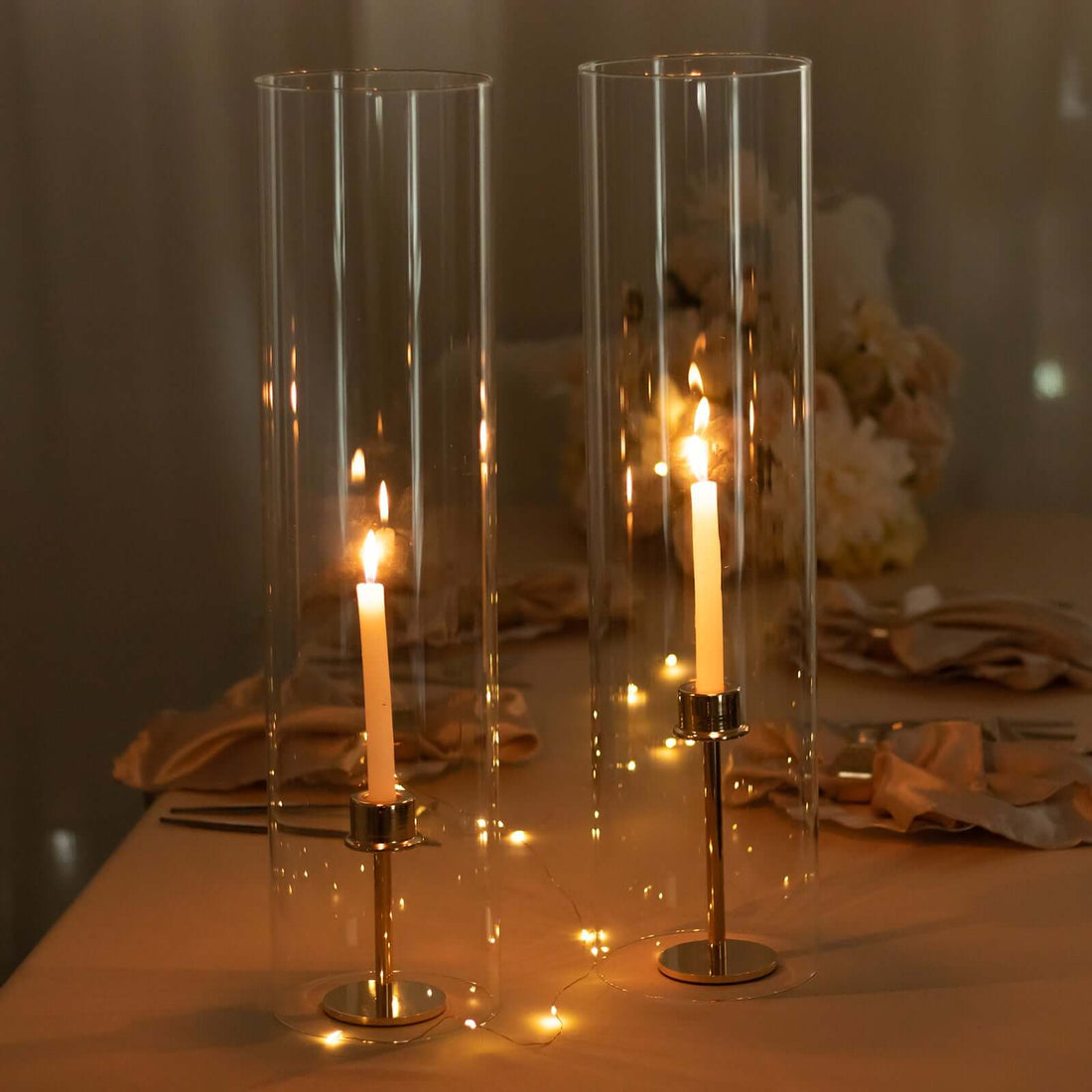 Elegant candle holders with candles, set on a beautifully arranged table.