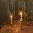 Elegant candle holders with candles, set on a beautifully arranged table.